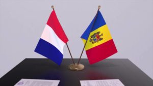 moldova-and-france-national-flags-on-table-in-diplomatic-conference-room-politics-deal-agreement-video
